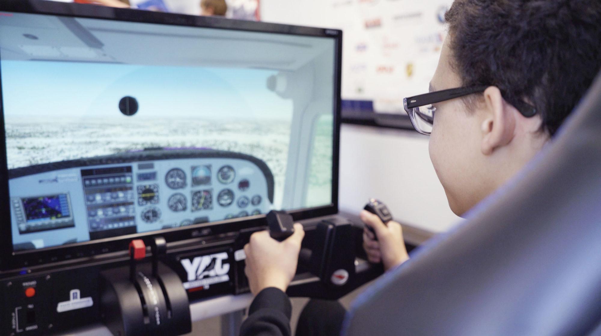 student using the flight simulator