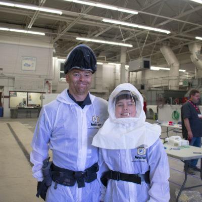 camper and mentor in paint suits