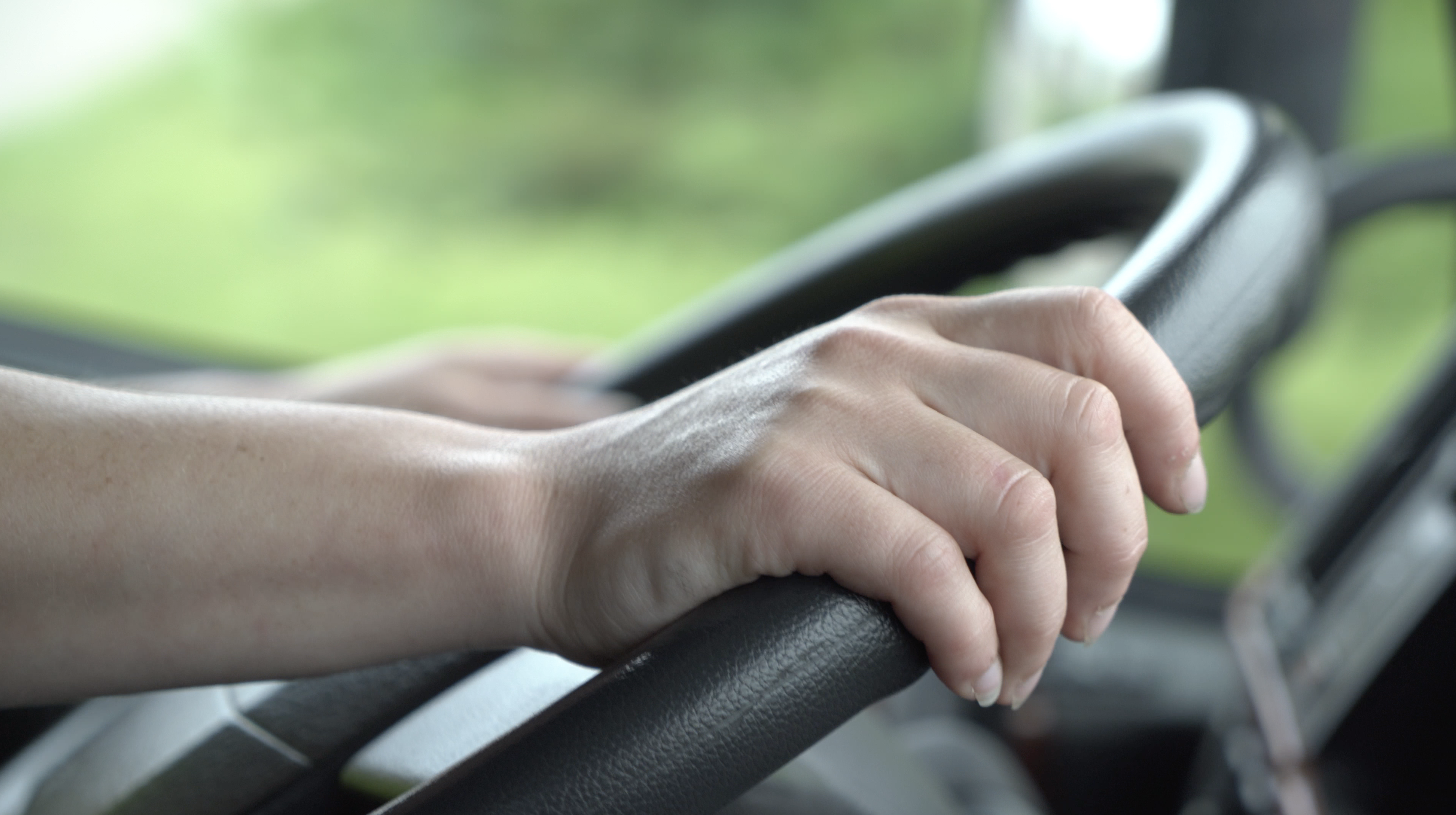 hands on a steering wheel