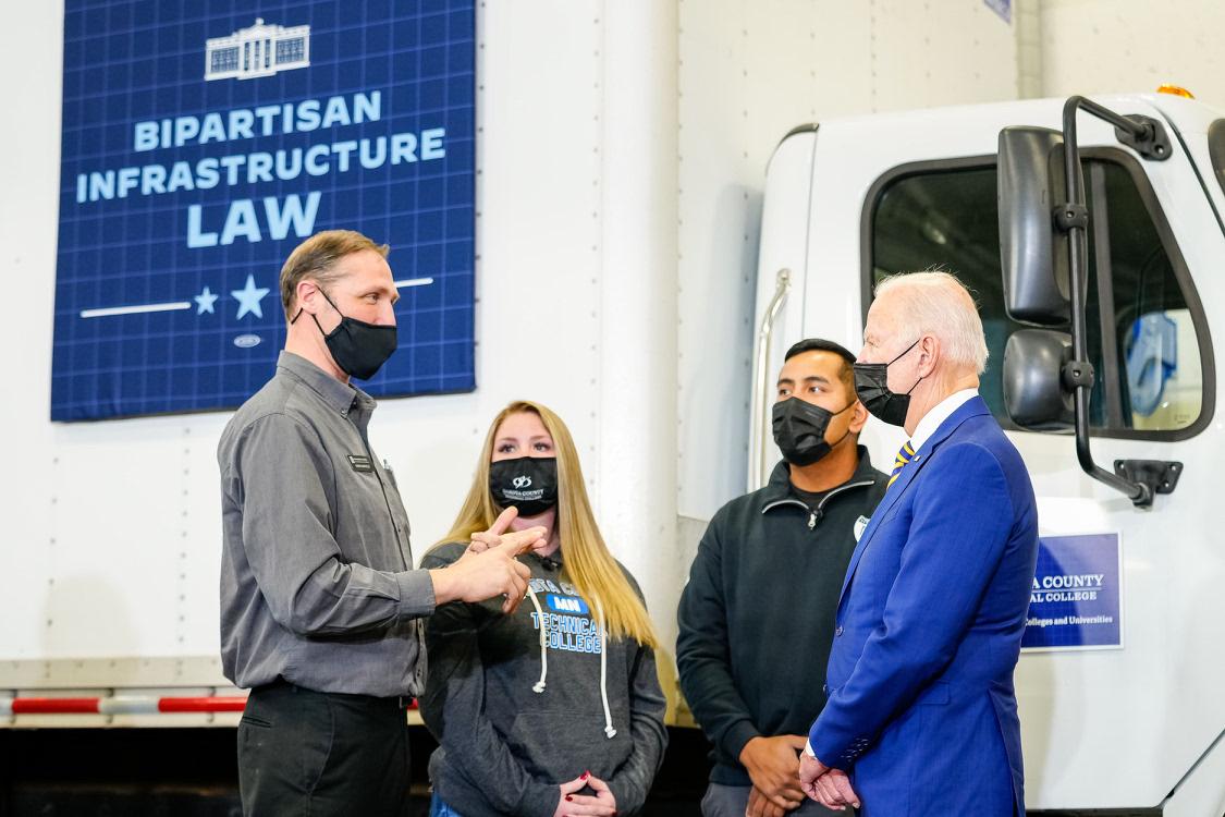 Chris talking to president Biden with students