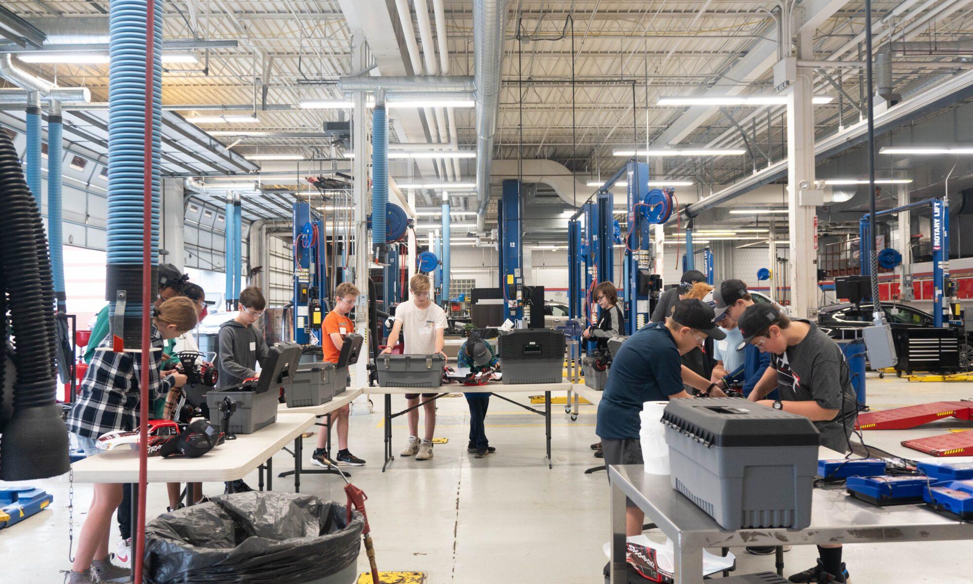 campers working on their RC cars