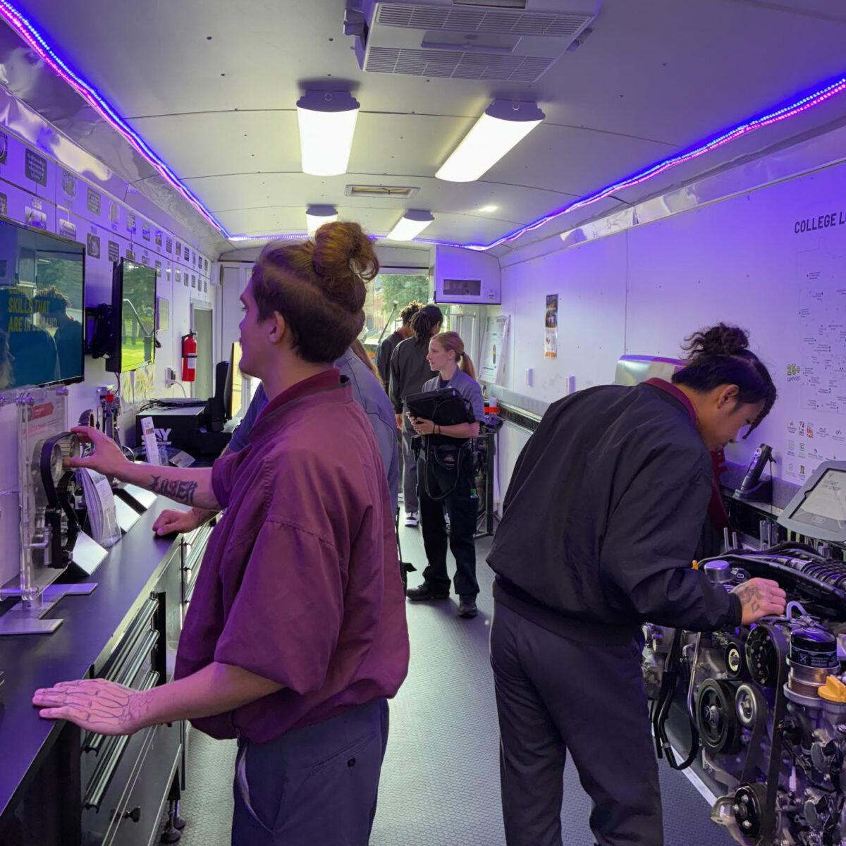 2 students exploring activities in the career exploration trailer